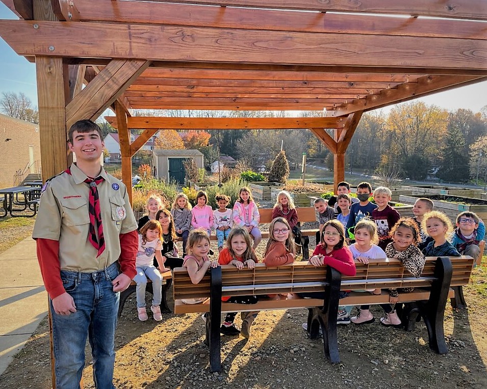 Anders Nordstrom with Conestoga students under the completed pergola