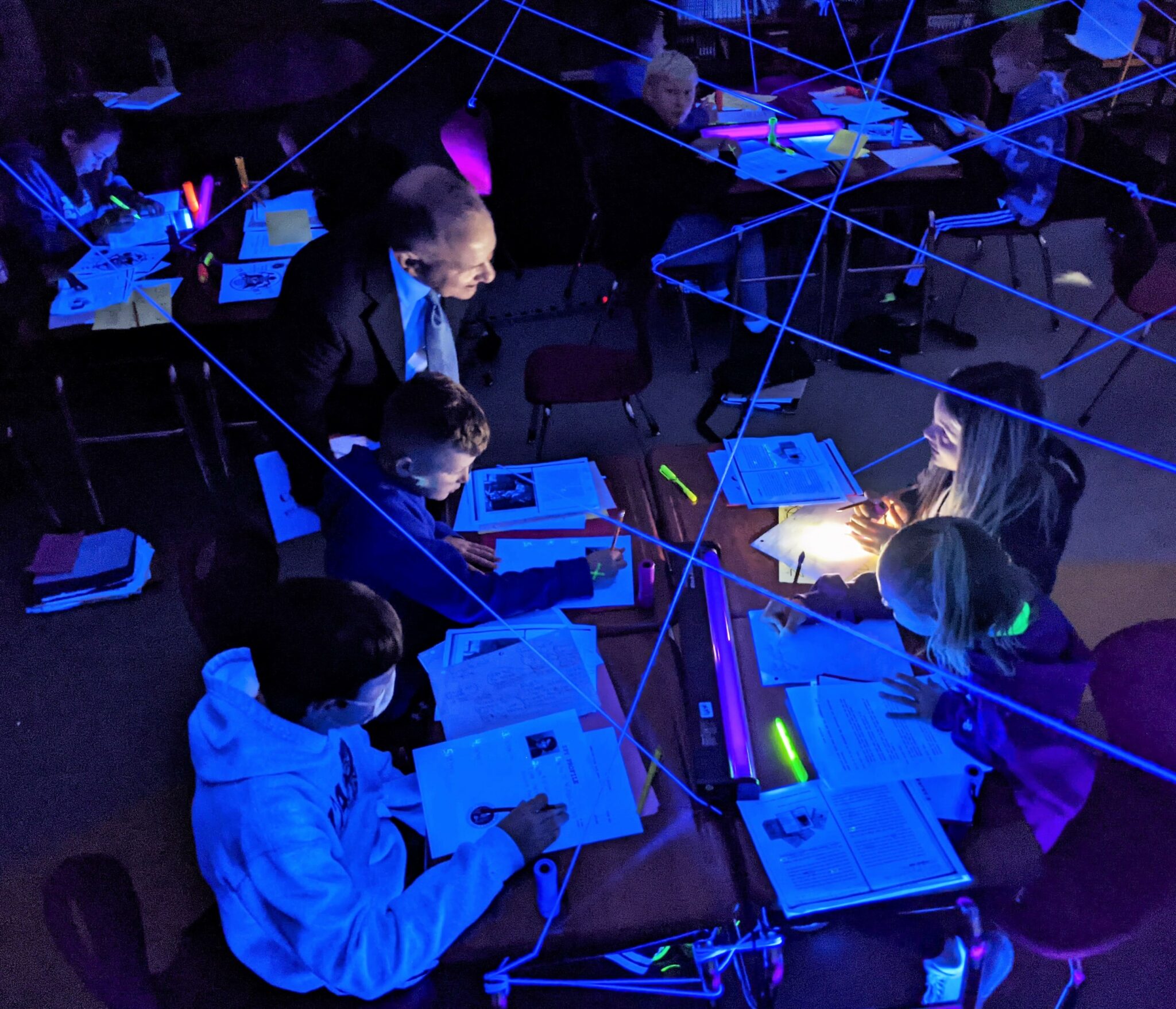 U.S. Representative Lloyd Smucker speaks with students during a spy lab lesson in Mrs. Raff's classroom.