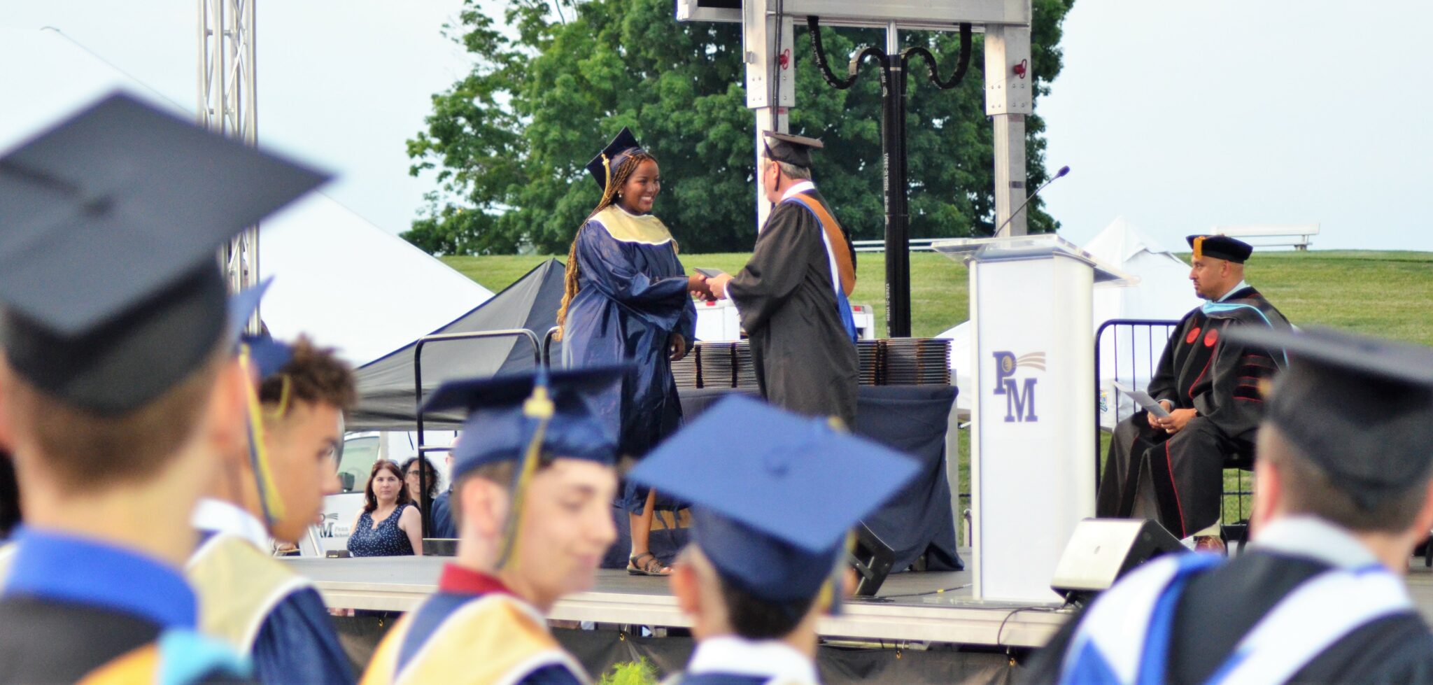 Photo of a student receiving her diploma