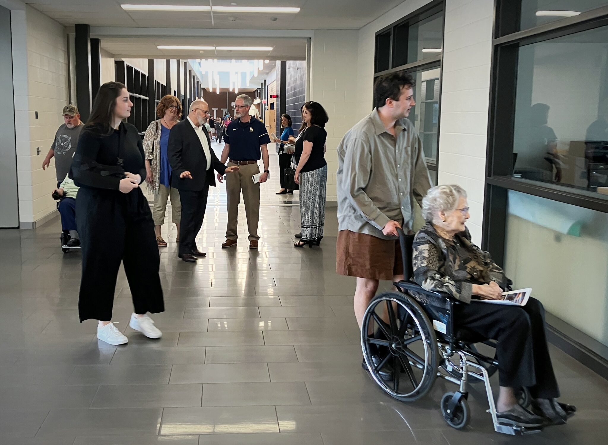 Photo of several people touring Penn Manor High School.