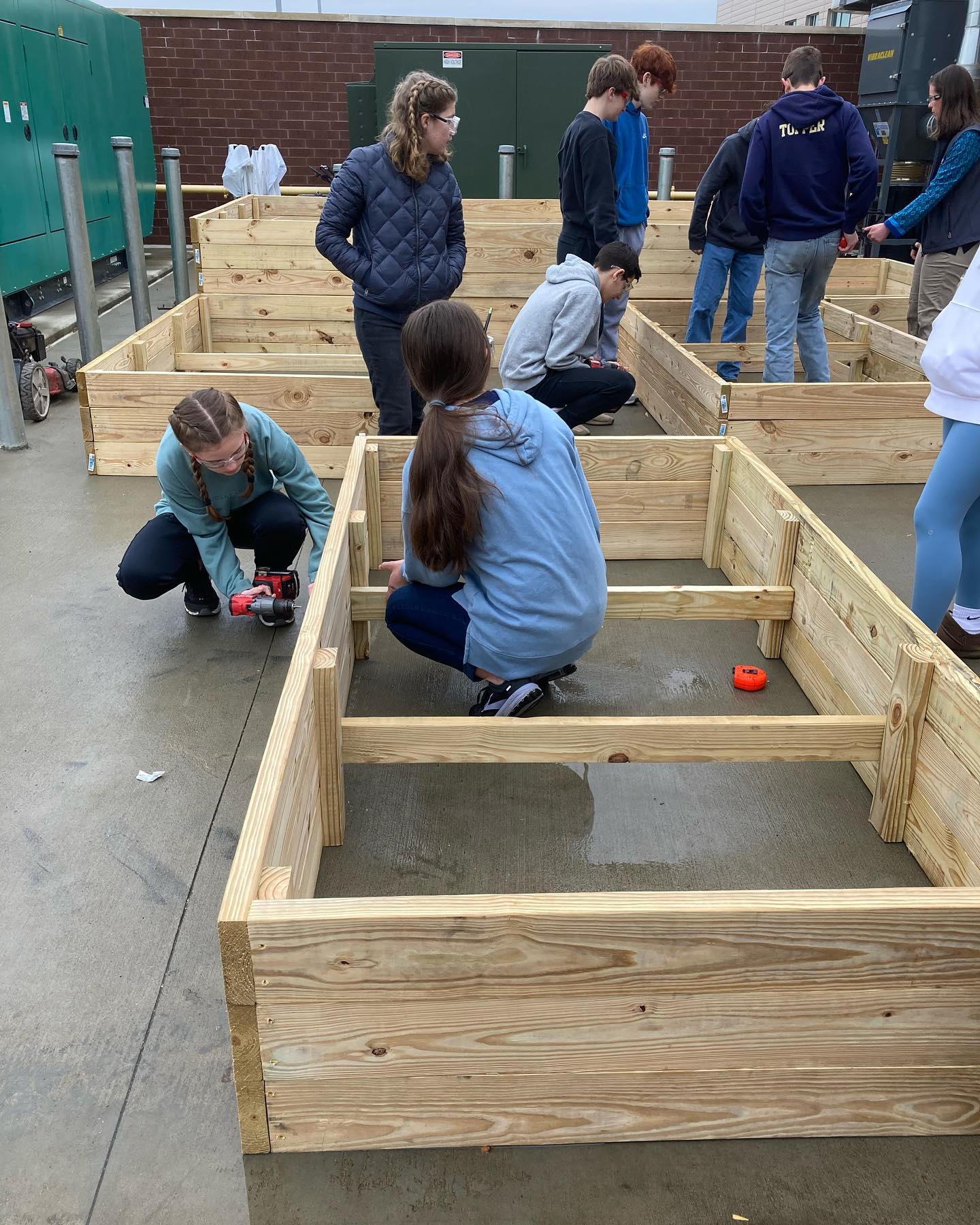 Photo of students building garden beds