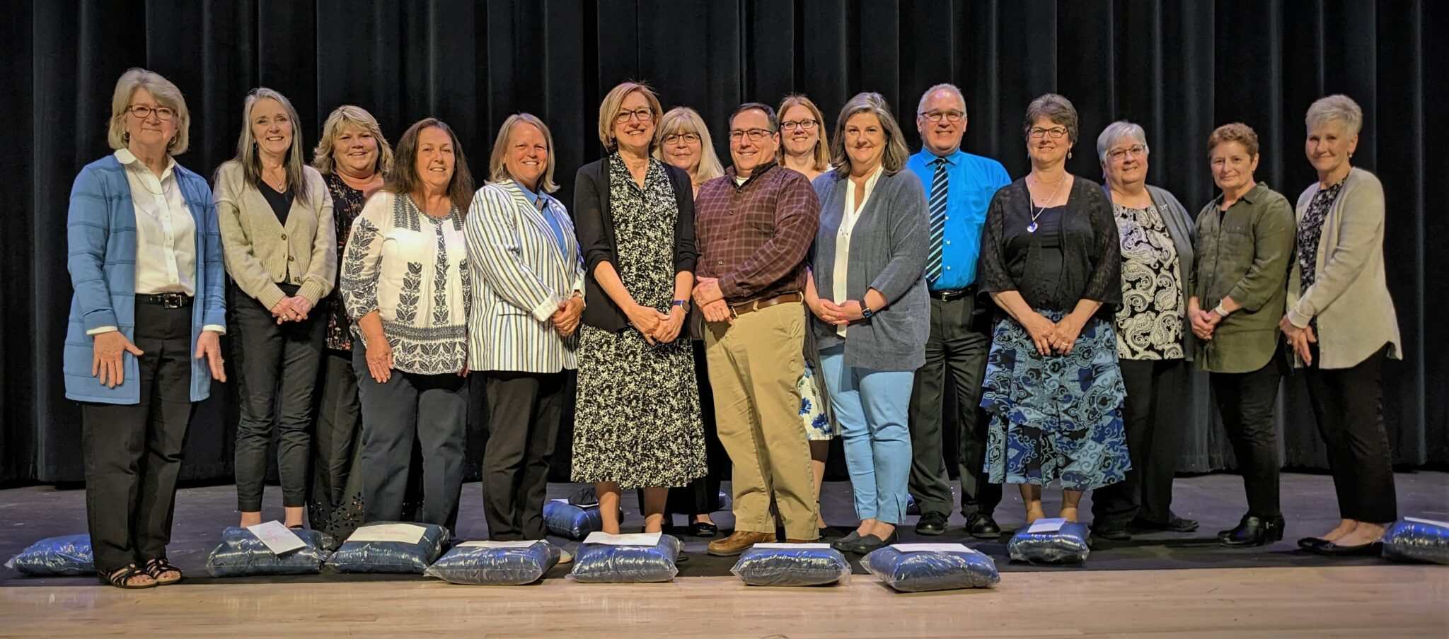 Group photo of 15 retirees who attended the ceremony.
