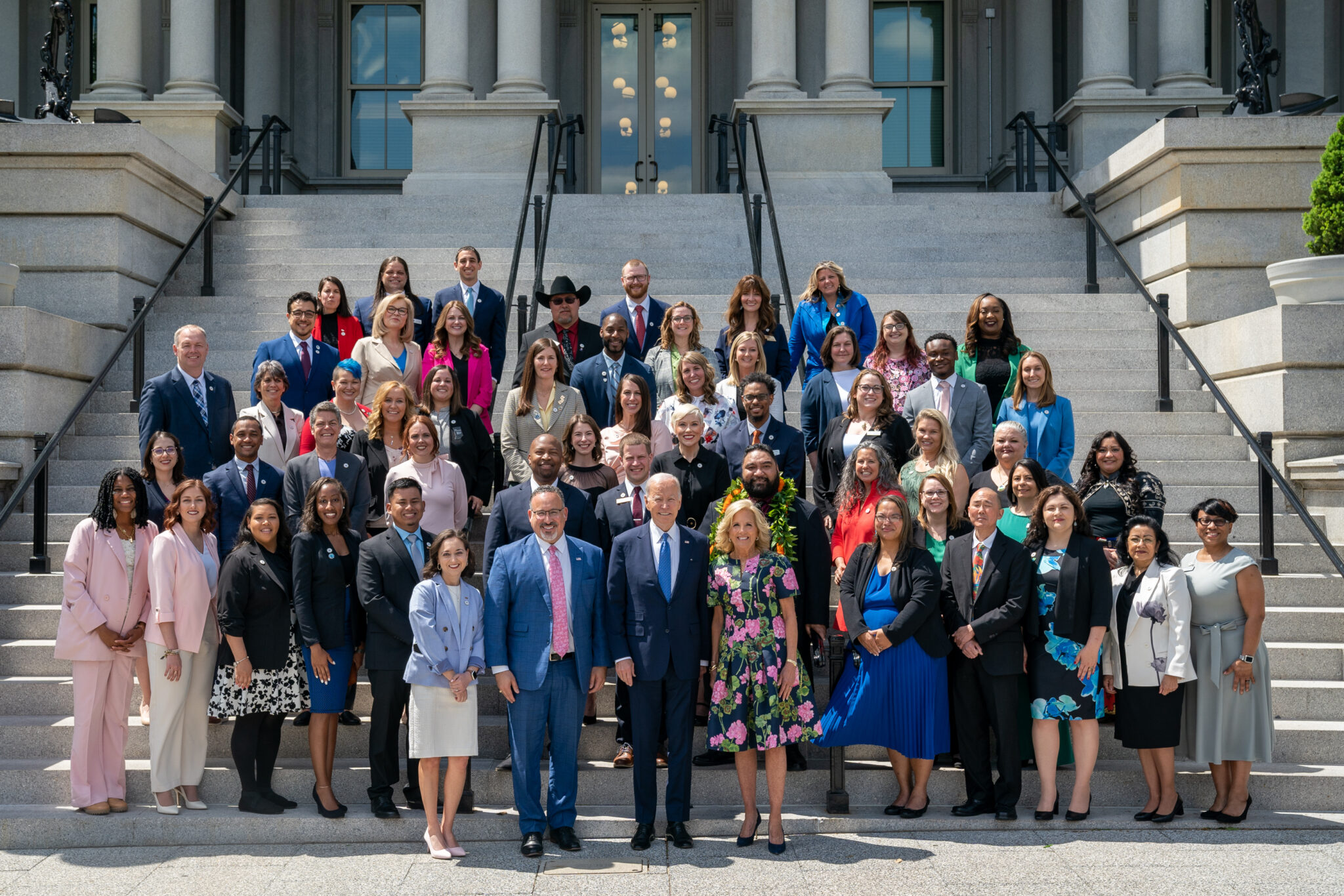 Group photo of the Teachers of the Year, Mr. and Mrs. Biden and Education Secretary Miguel Cardona at the White House steps.