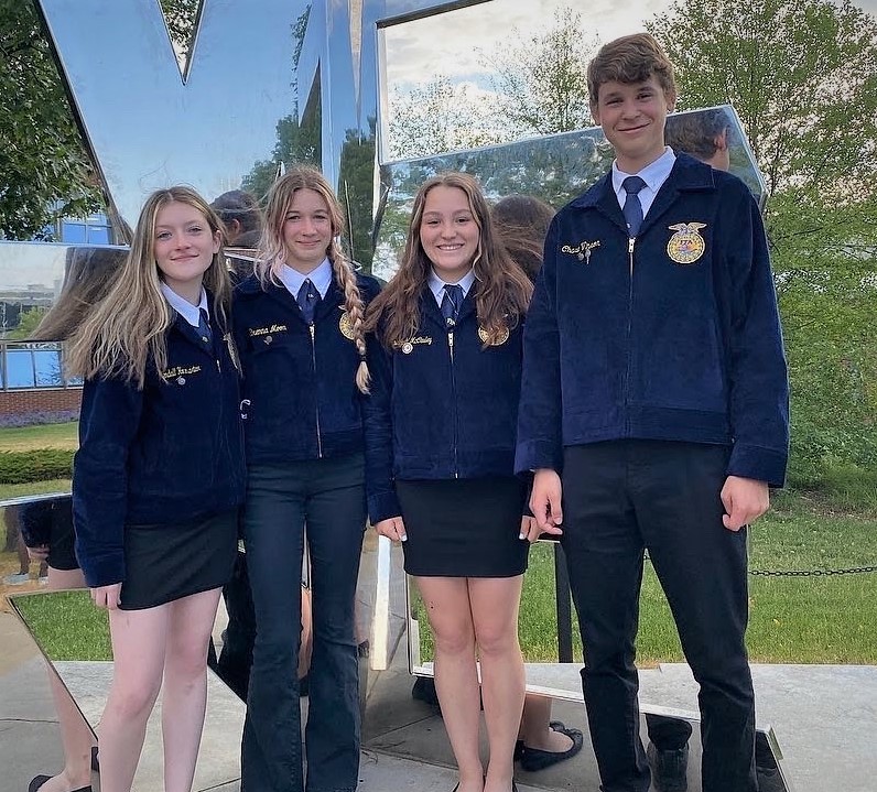 Photo of four students who are on the Livestock Evaluation Team.